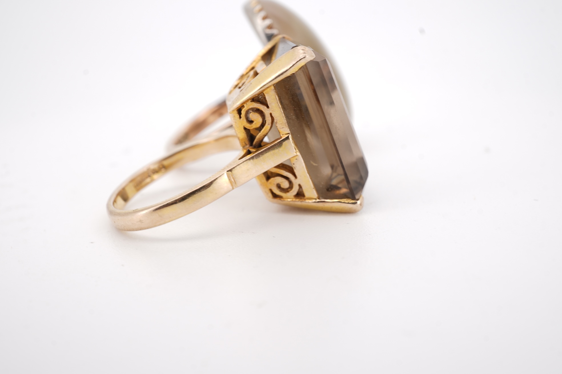 A modern 9ct gold and single stone emerald cut smoky quartz set ring, size N and one other 1960's 9ct gold shank, with a later added agate set white metal mount.